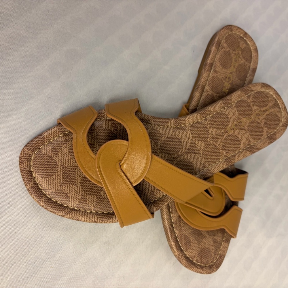 Coach women’s Flat Slip On open Toe Tan Sandals